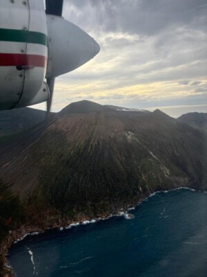 View from surveying plane of coastline around a mountain