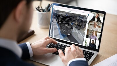 Man collaborating virtually with coworkers while viewing a digital model.