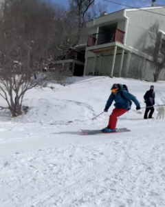 A skier skis down the street in Austin