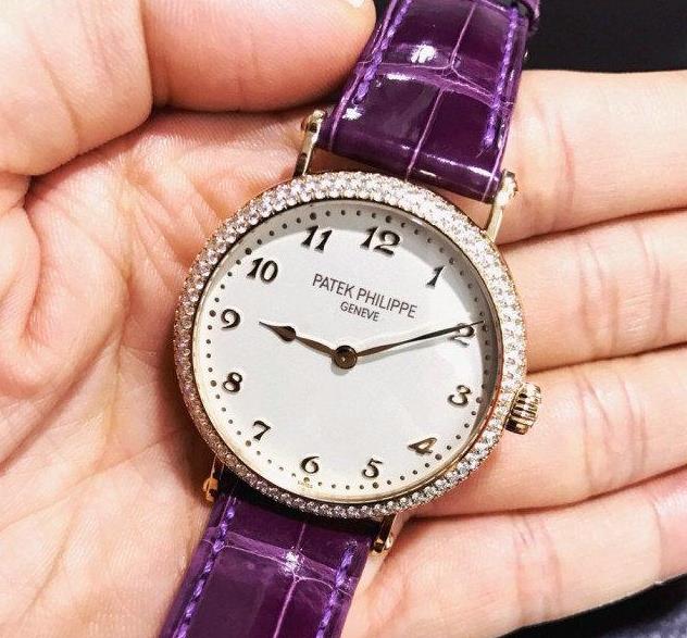 The diamonds and royal purple leather strap enhance the nobility of this Patek Philippe.